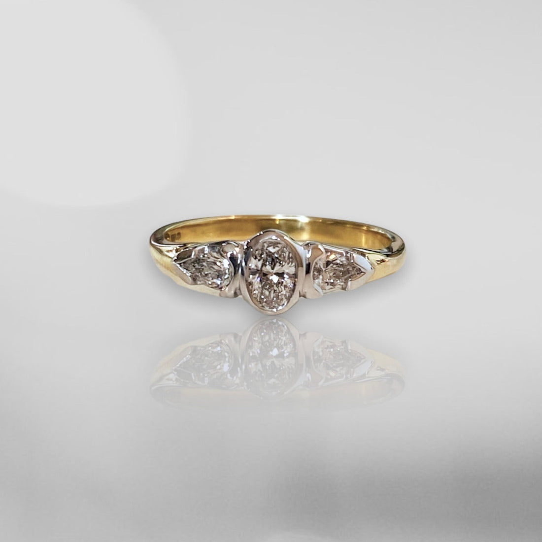Round & Pear Shaped Diamond Engagement Ring
