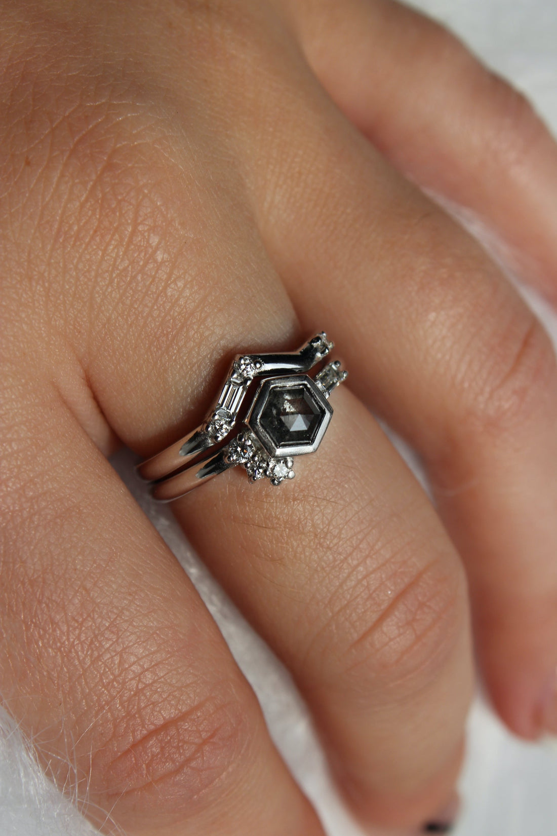 Set of alternative style wedding and engagement rings, platinum and salt and pepper diamonds