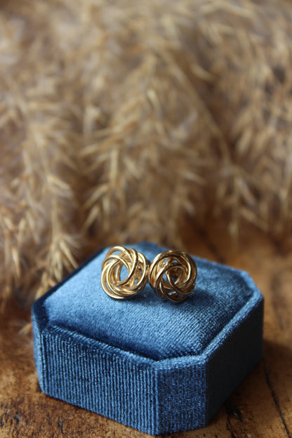 Gold swirl knot earrings